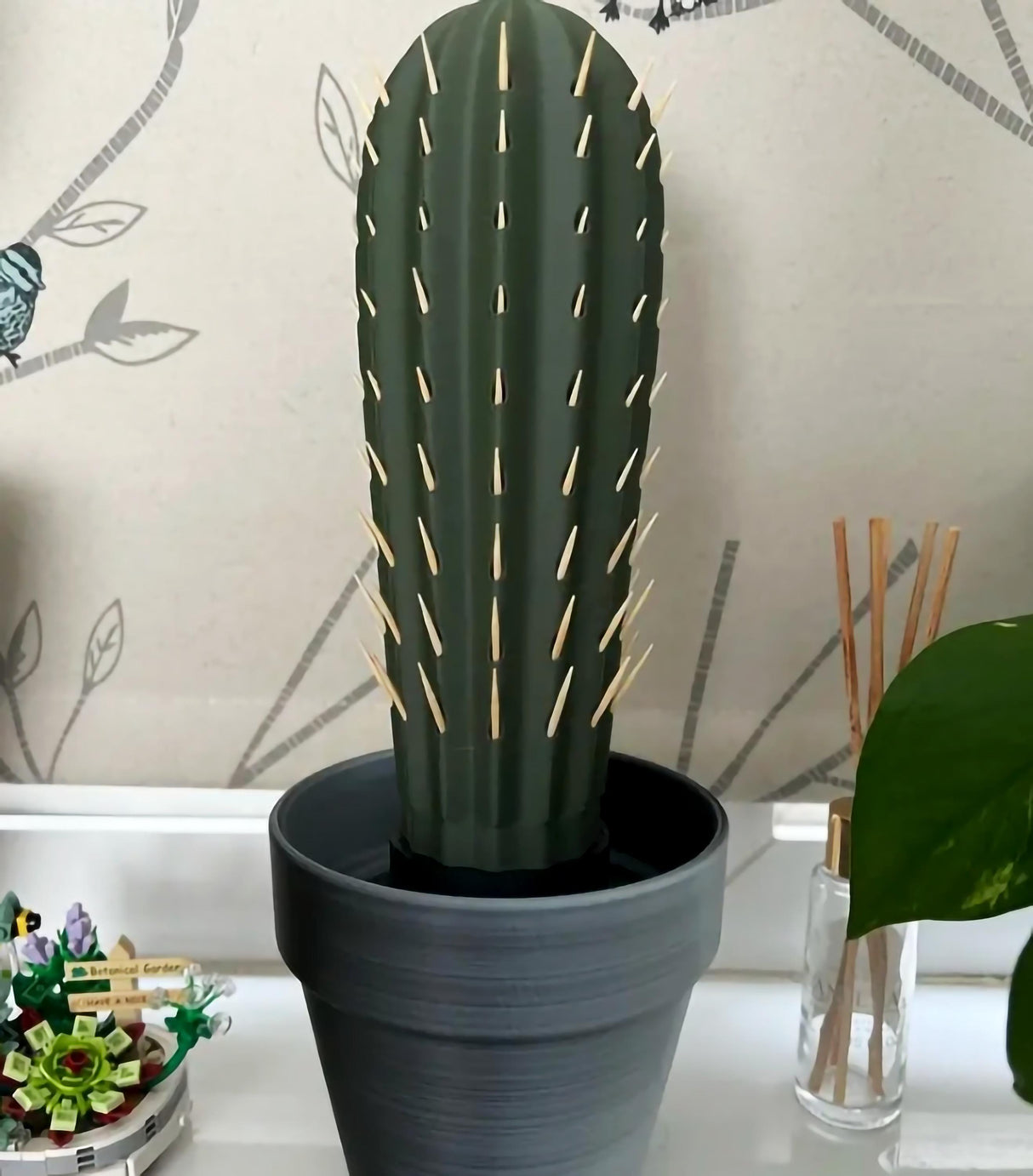 3D printed cactus toothpick holder in a pot with toothpicks resembling spines, perfect for party tables and kitchen decor.
