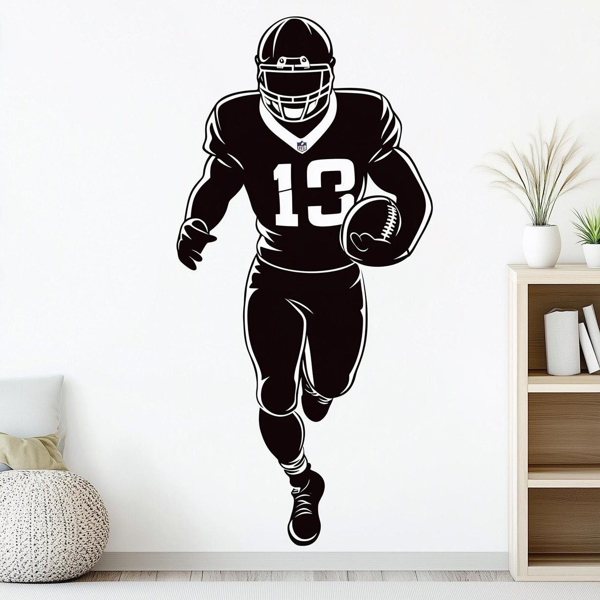 Football player wall decal, black silhouette running with football, perfect for boys' rooms or sports-themed decor.