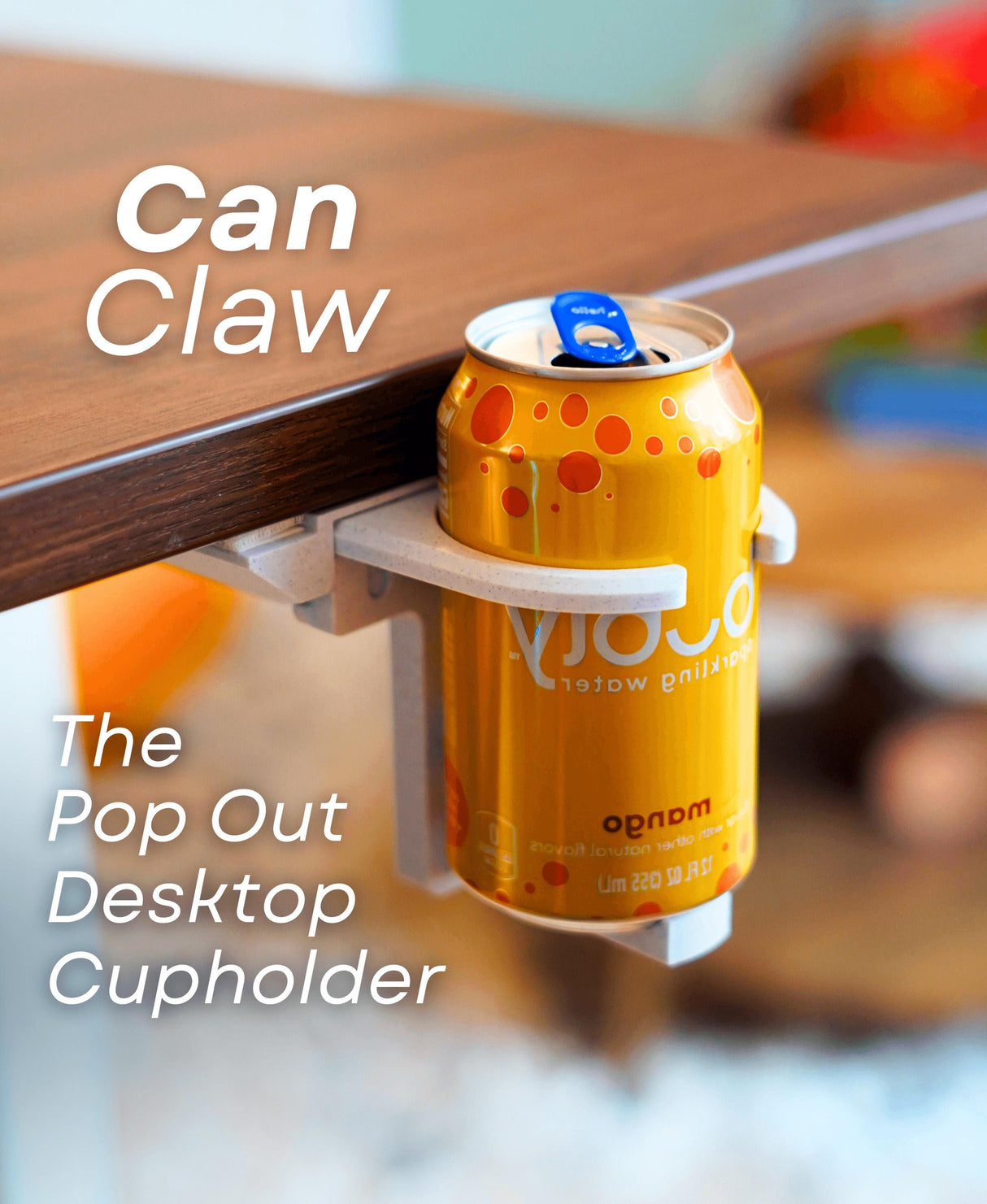 Can Claw pop-out desktop cup holder securing a drink under a desk, perfect for minimalist workspaces.