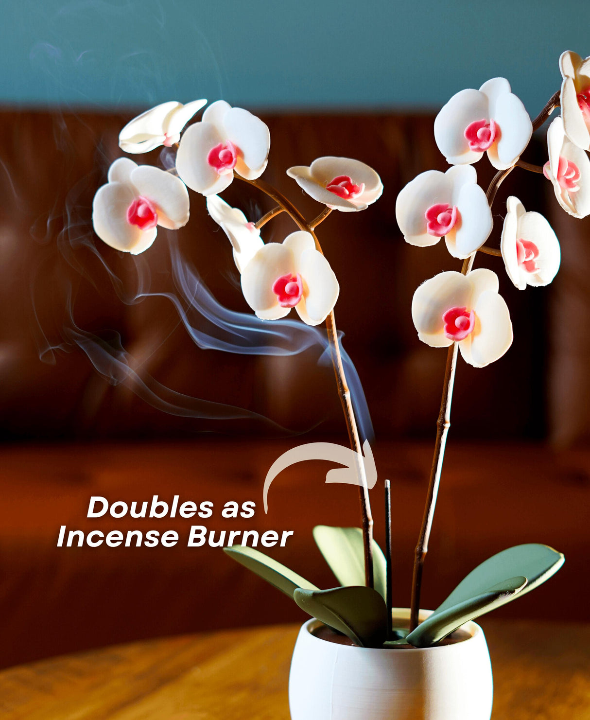 Aromatic orchid oil diffuser and incense holder with steam, showcasing its elegant design and dual functionality.