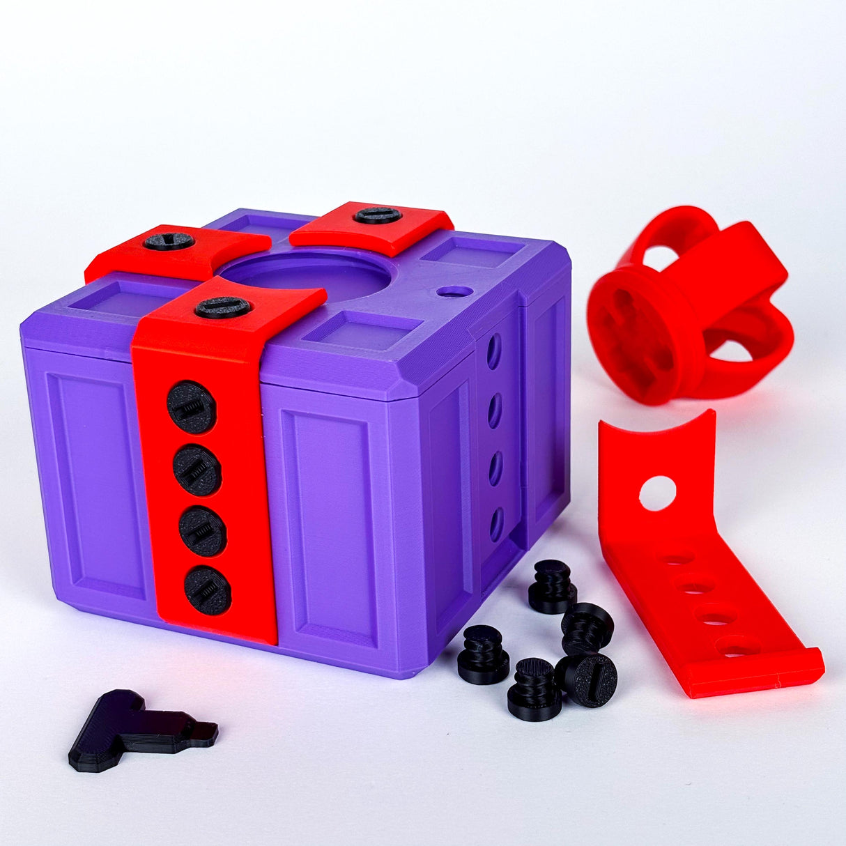 3D printed Annoying Gift Box in purple and red, featuring unscrews and colorful components for a fun challenge.