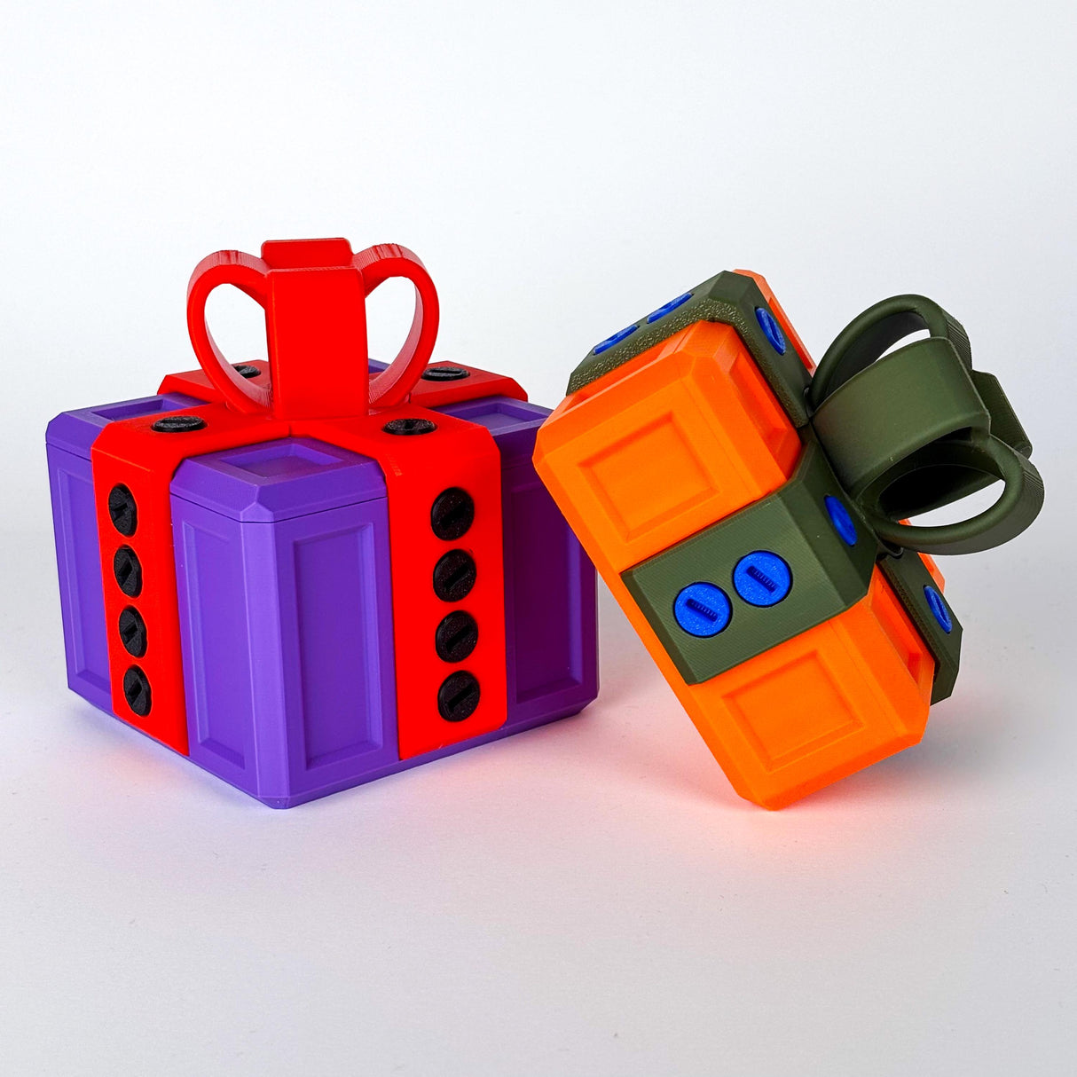 Colorful 3D printed annoying gift boxes designed for fun challenges and gag gifts, featuring vibrant colors and locking mechanisms.