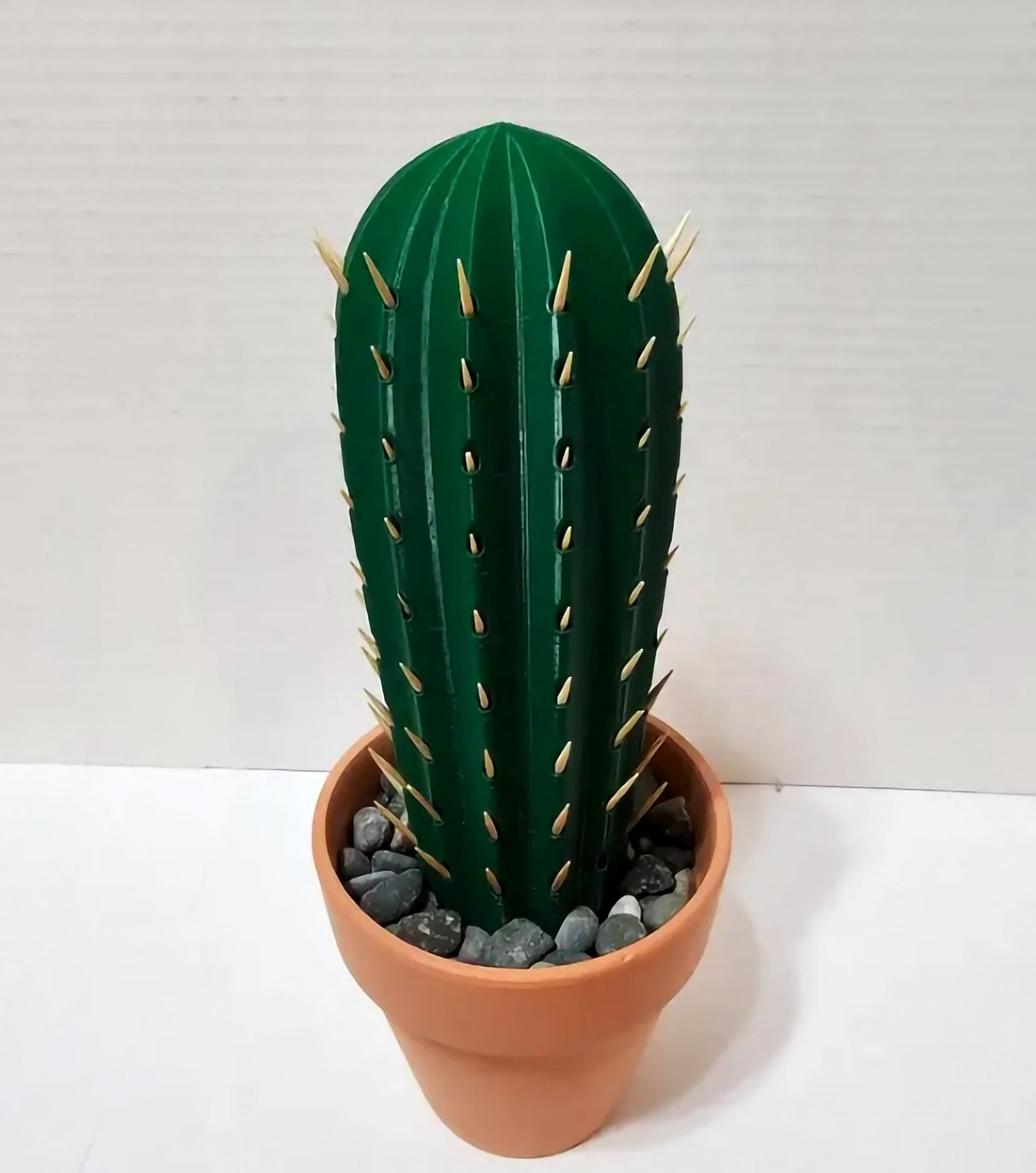 3D printed cactus toothpick holder with toothpicks as spines in a terra cotta pot, ideal party accessory.