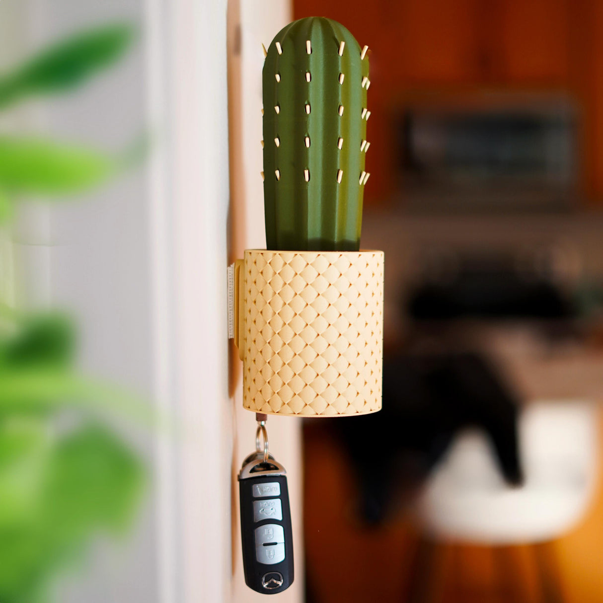 SpiKey cactus key holder mounted on wall, featuring a playful 3D printed design with keys hanging below.