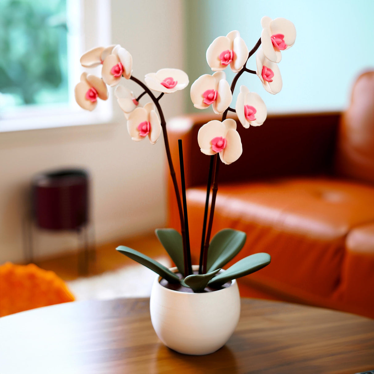 Aromatic orchid oil diffuser with 3D printed flower pot, featuring pink blooms and green leaves, elegant home decor.