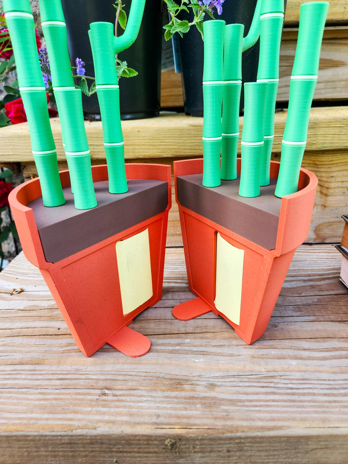 Bamboo-themed bookends and pen holder set with post-it note dispenser on a wooden table.