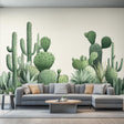 Watercolor cactus wall decal sticker in a modern living room with gray sofa and decorative pillows.