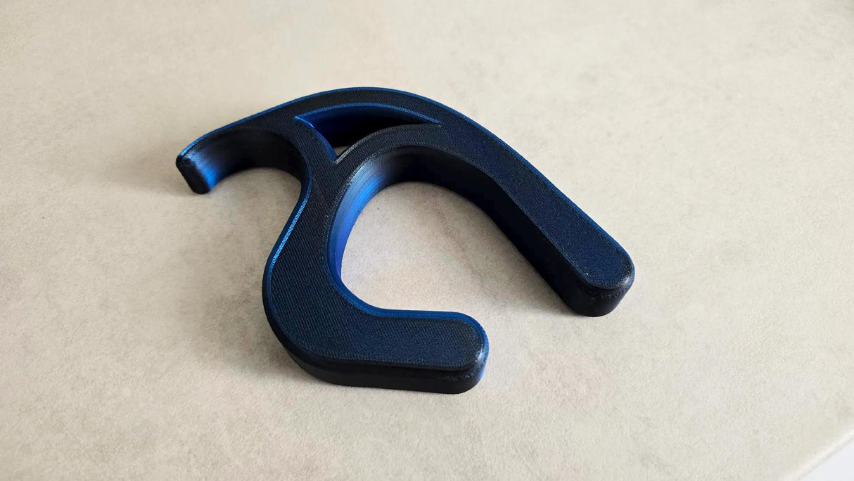 3D printed desk bag hook in blue, designed to hold bags securely and keep them off the floor.