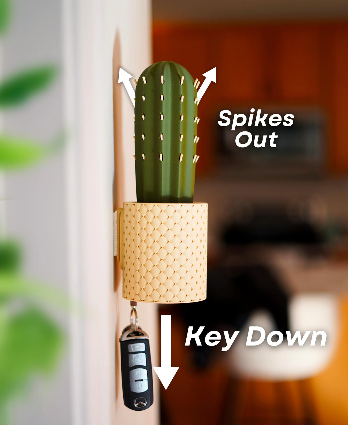 SpiKey cactus key holder wall-mounted with spikes out, key down; unique and fun key storage solution for entryway decor.