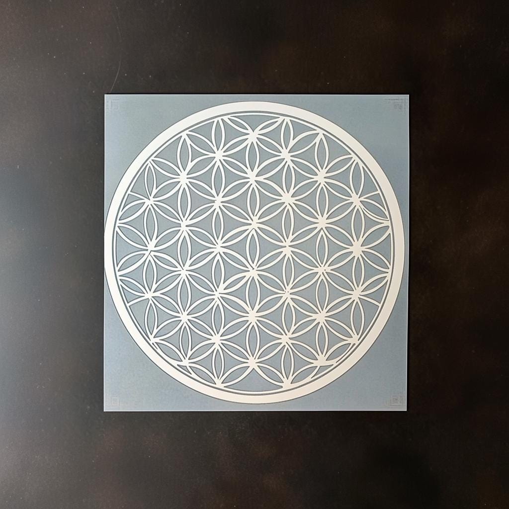 Flower of Life stencil for DIY wall painting or crafts, showcasing intricate sacred geometry design on a blue background.