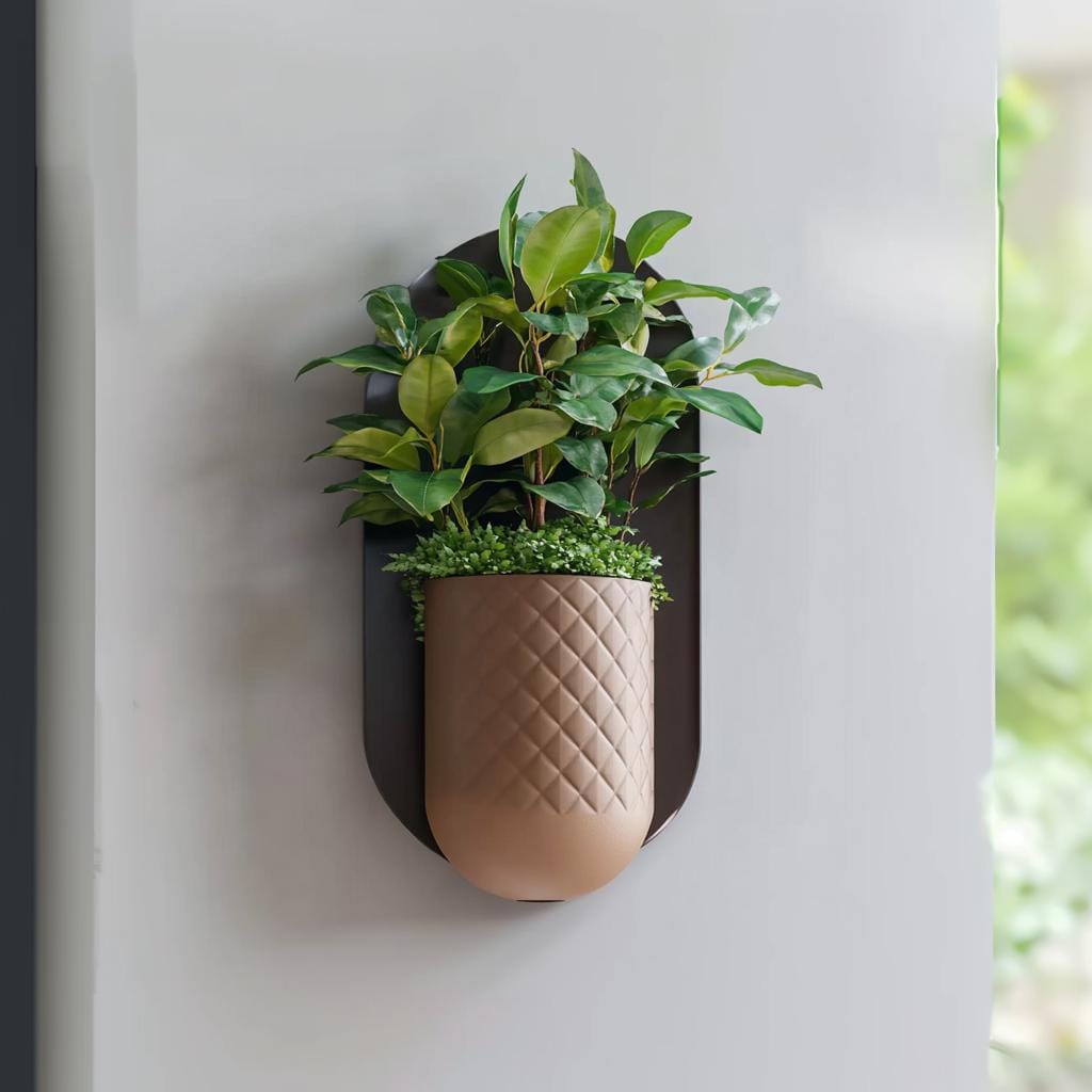 Modern minimalist wall planter with green plants, featuring a hidden wall mount and textured geometric design.