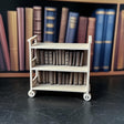 1:12 scale miniature library cart with books, perfect for dollhouse furniture and play.