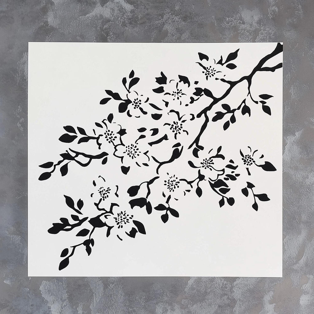 Black cherry blossom stencil on a white background, perfect for DIY wall painting and craft projects.