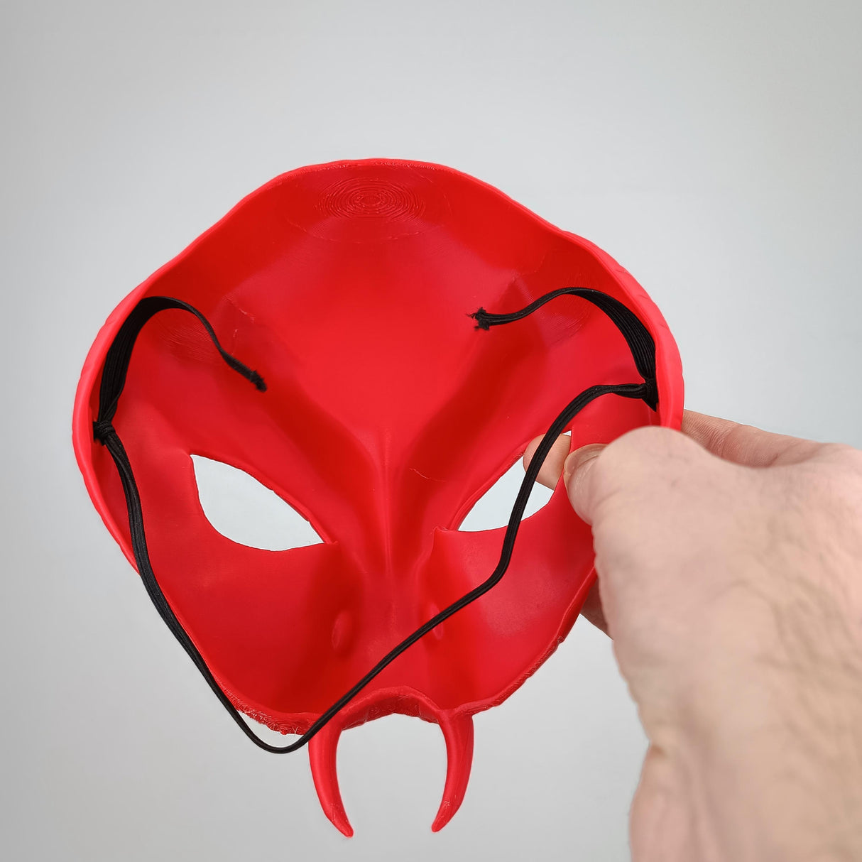 Inside view of a 3D printed red Snake Demon mask with detailed textures and adjustable straps.