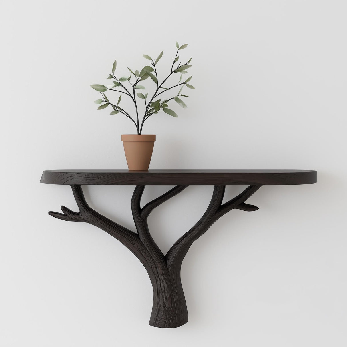 Tree branch wall shelf with black matte finish and potted plant, showcasing modern minimalist nature-inspired decor.