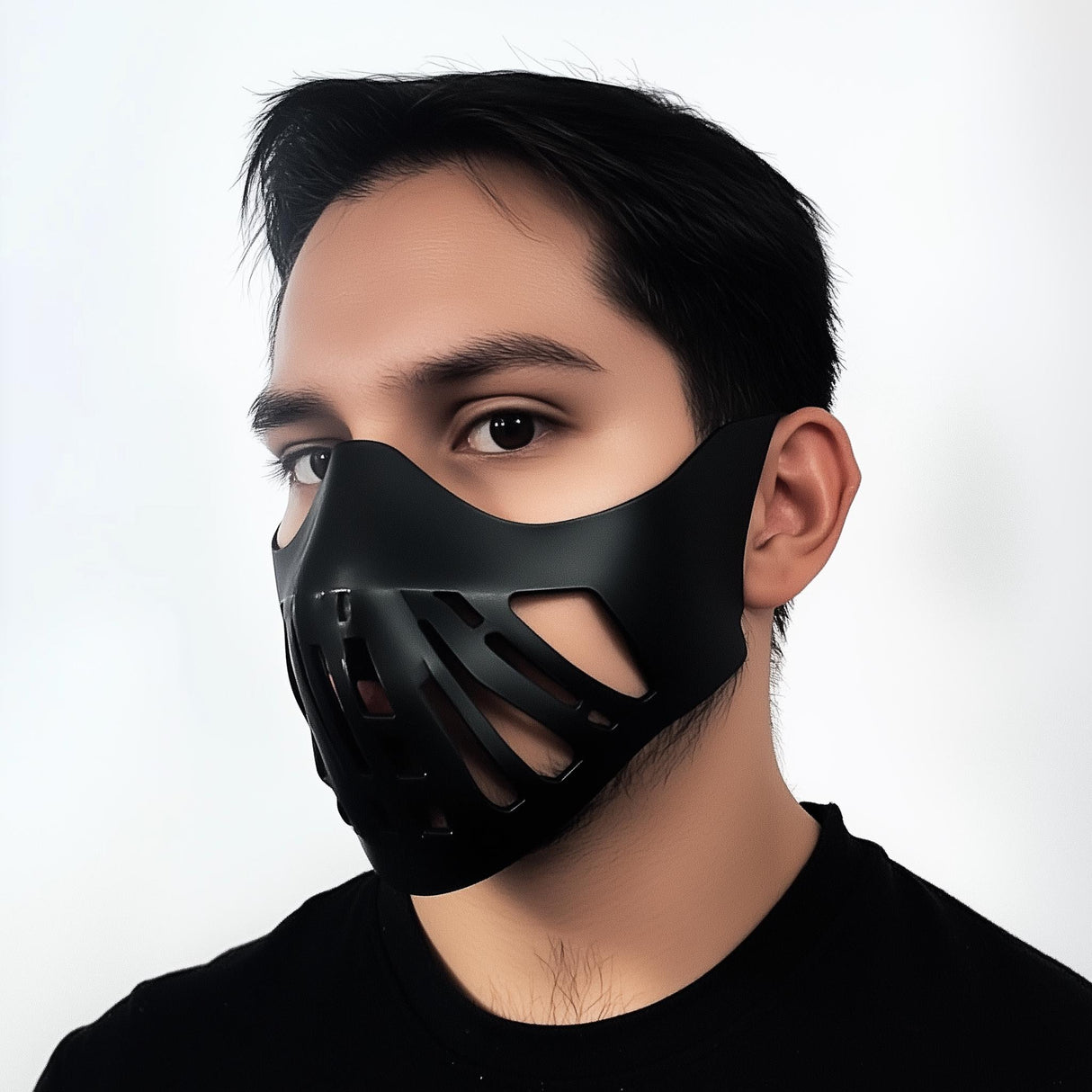 Futuristic black tactical face mask on a male model, perfect for cosplay or Halloween costumes.
