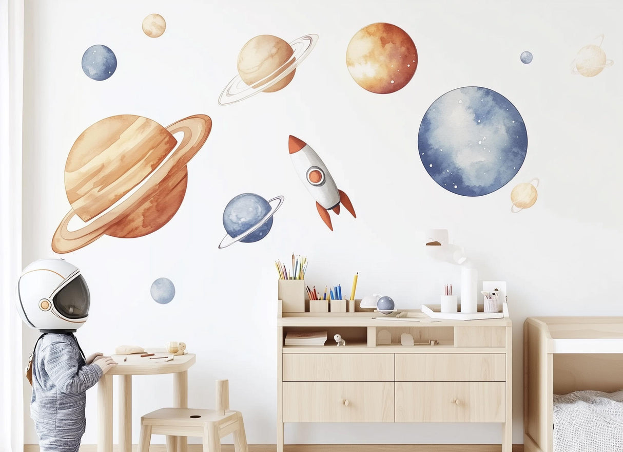 Child in astronaut helmet enjoying solar system wall decals in a dreamy kids room with planets and rockets.