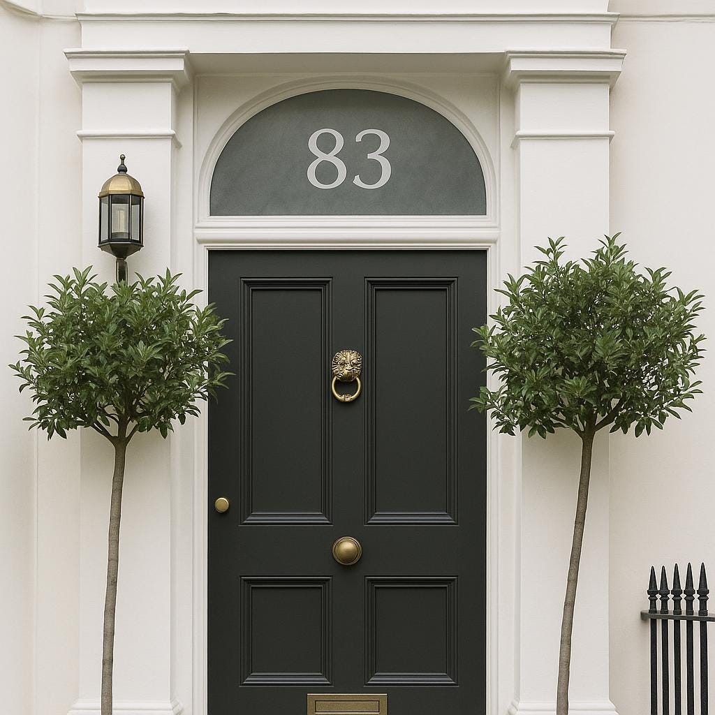 Elegant black front door with number 83 and frosted fanlight, flanked by two potted trees.