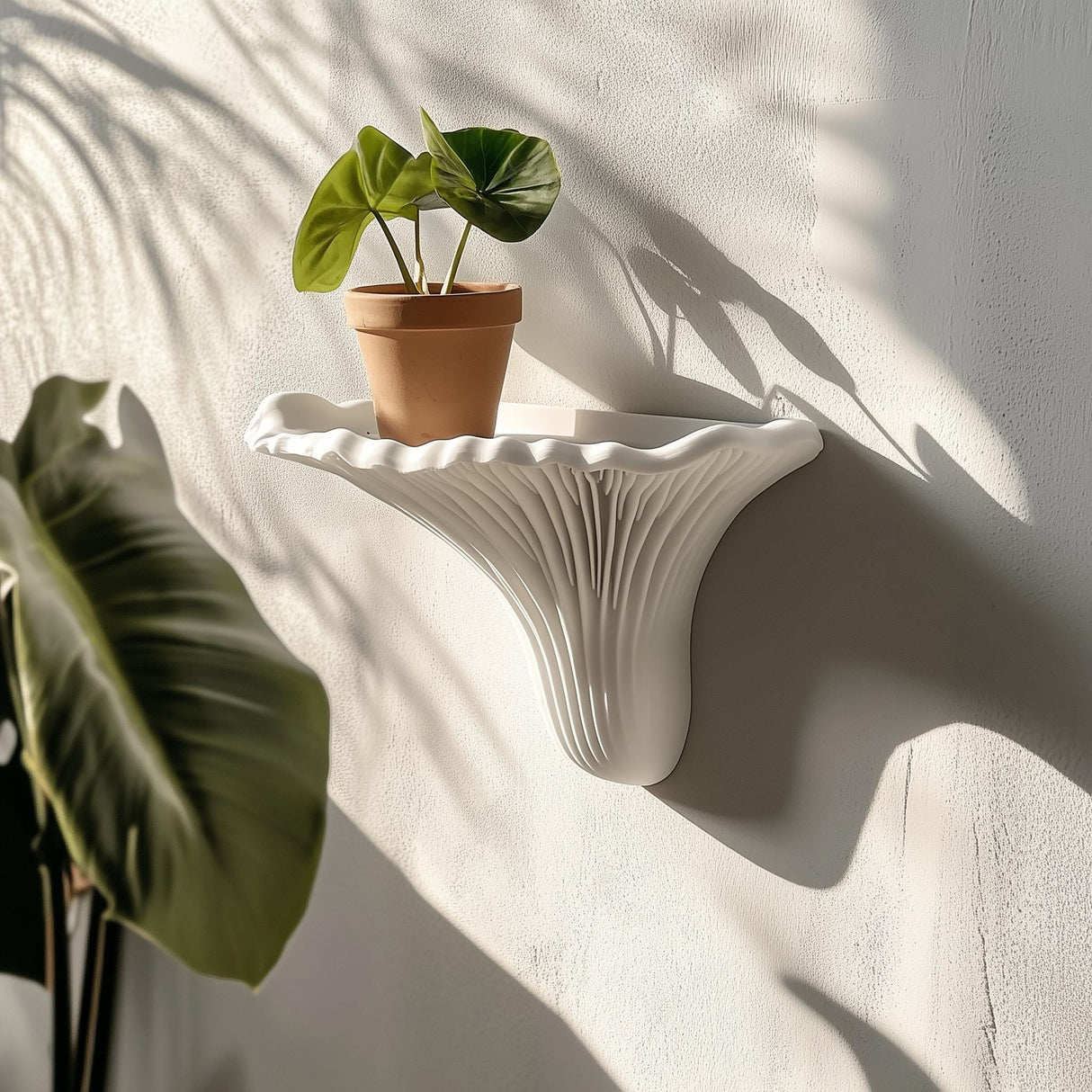 3D printed mushroom wall shelf with potted plant, showcasing minimalist design and organic texture.