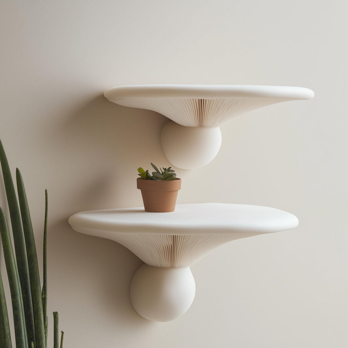 2 sculptural 3D printed mushroom wall shelves featuring a small potted plant, minimalist home decor accent.