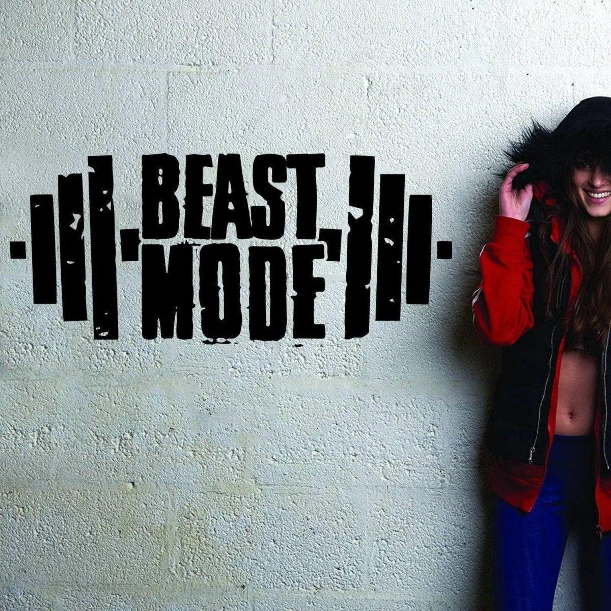 Beast Mode fitness wall decal displayed with a woman in a hoodie, inspiring workout motivation.