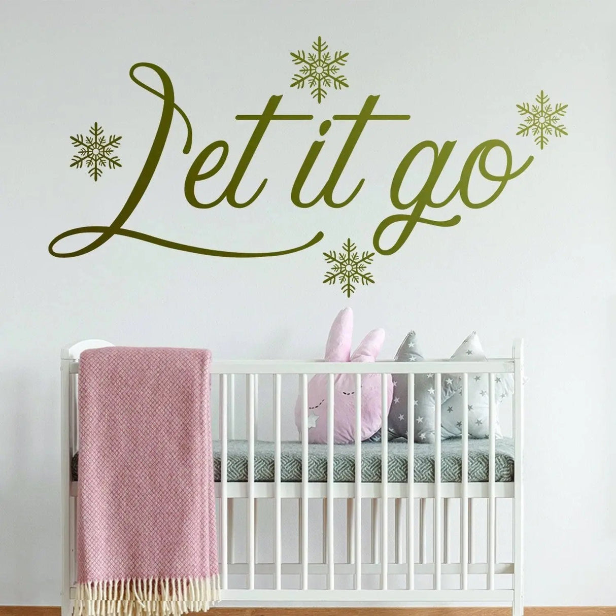 Inspirational wall sticker 'Let it go' in green, adorned with snowflakes, perfect for winter-themed decor.