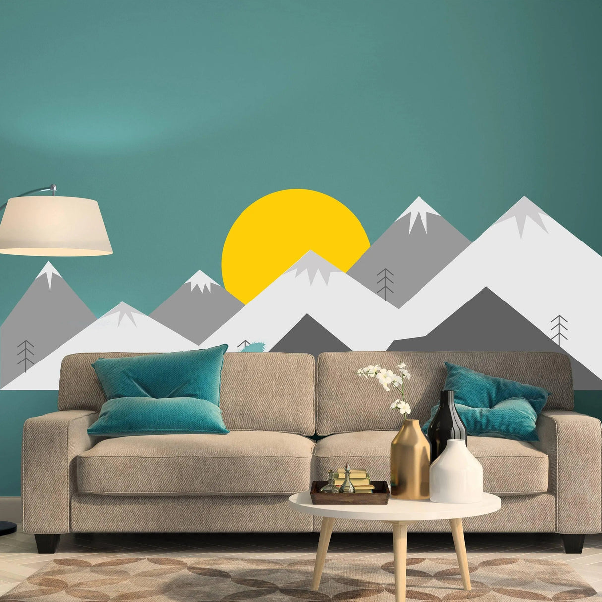 Mountain wall decal in teal room with couch and lamp, showcasing vibrant colors and modern design.