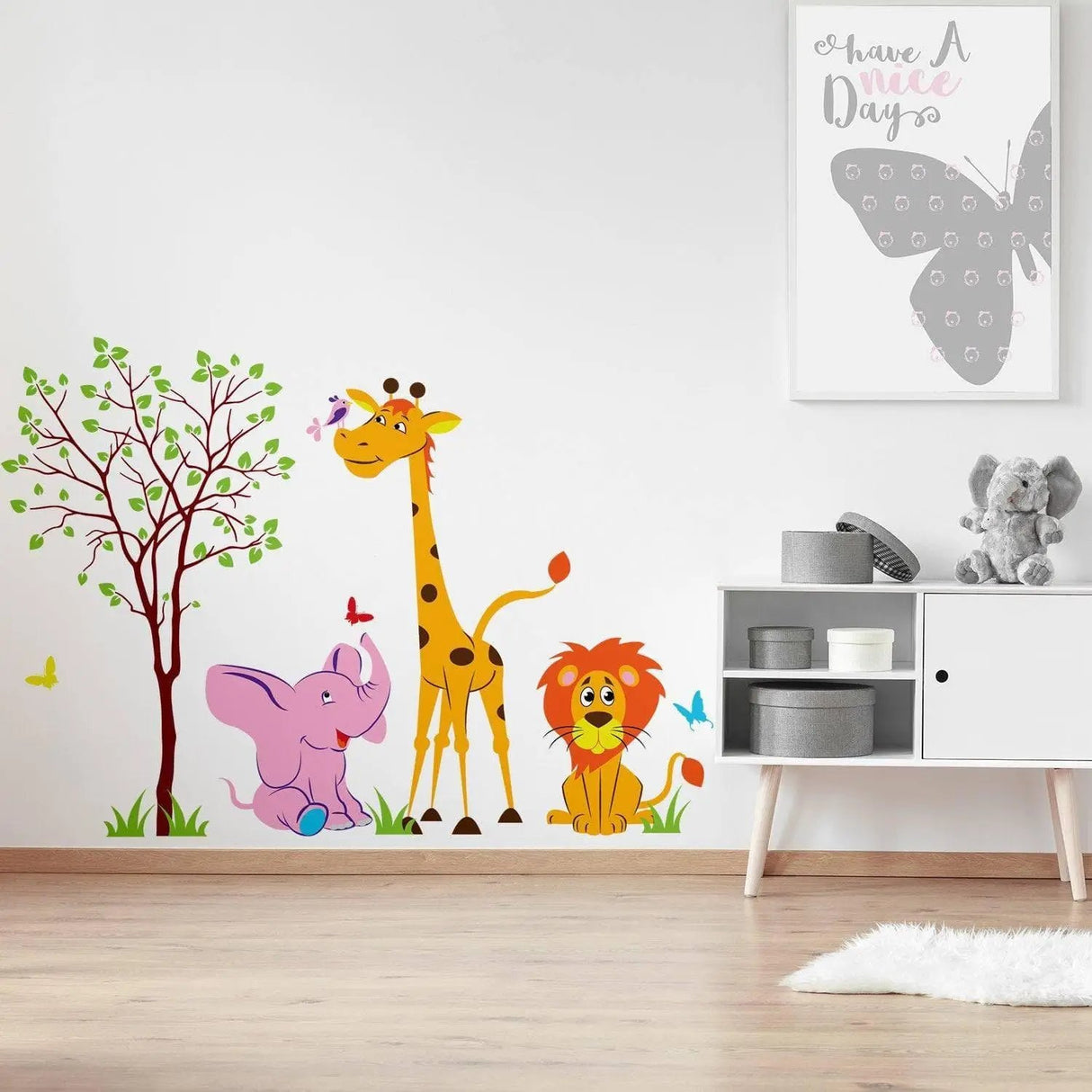 Colorful safari animal wall decal featuring a giraffe, elephant, and lion, perfect for nursery decor.
