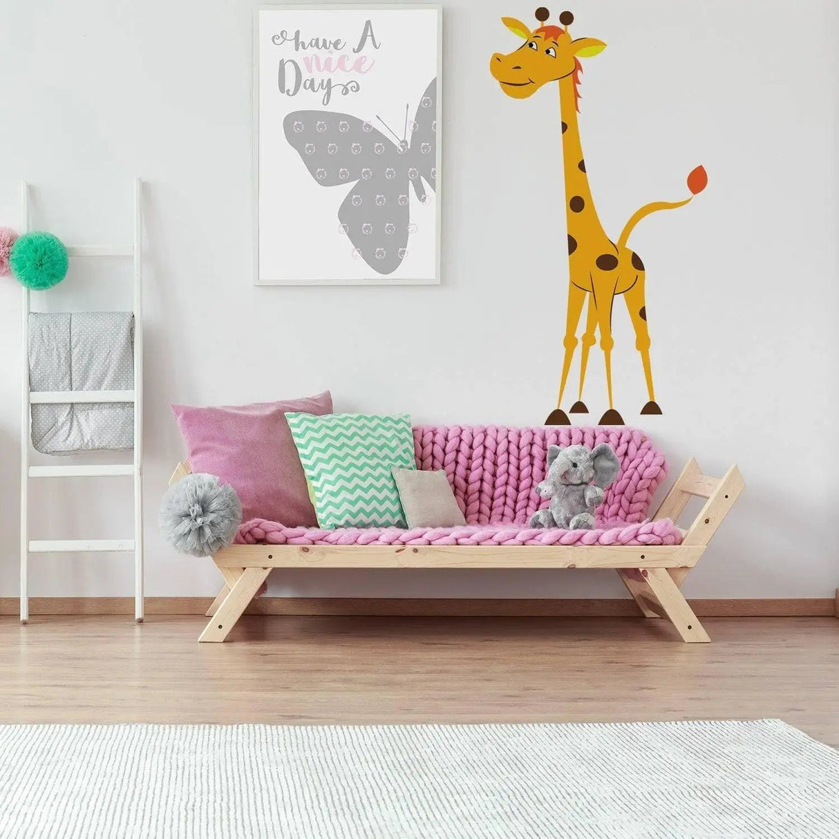 Cute giraffe wall decal in a stylish kids' nursery, enhancing the playful animal-themed decor.