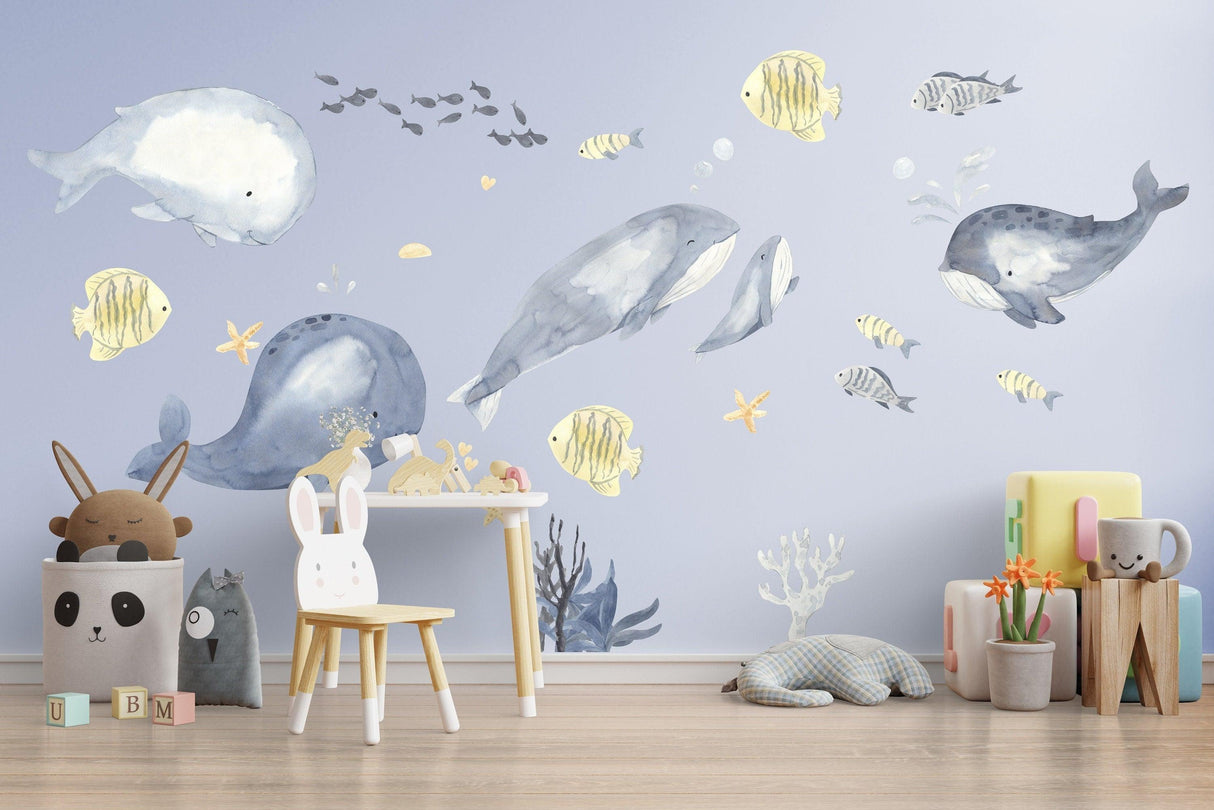 Undersea themed wall decals featuring playful whales and ocean creatures, perfect for a child's room decor.