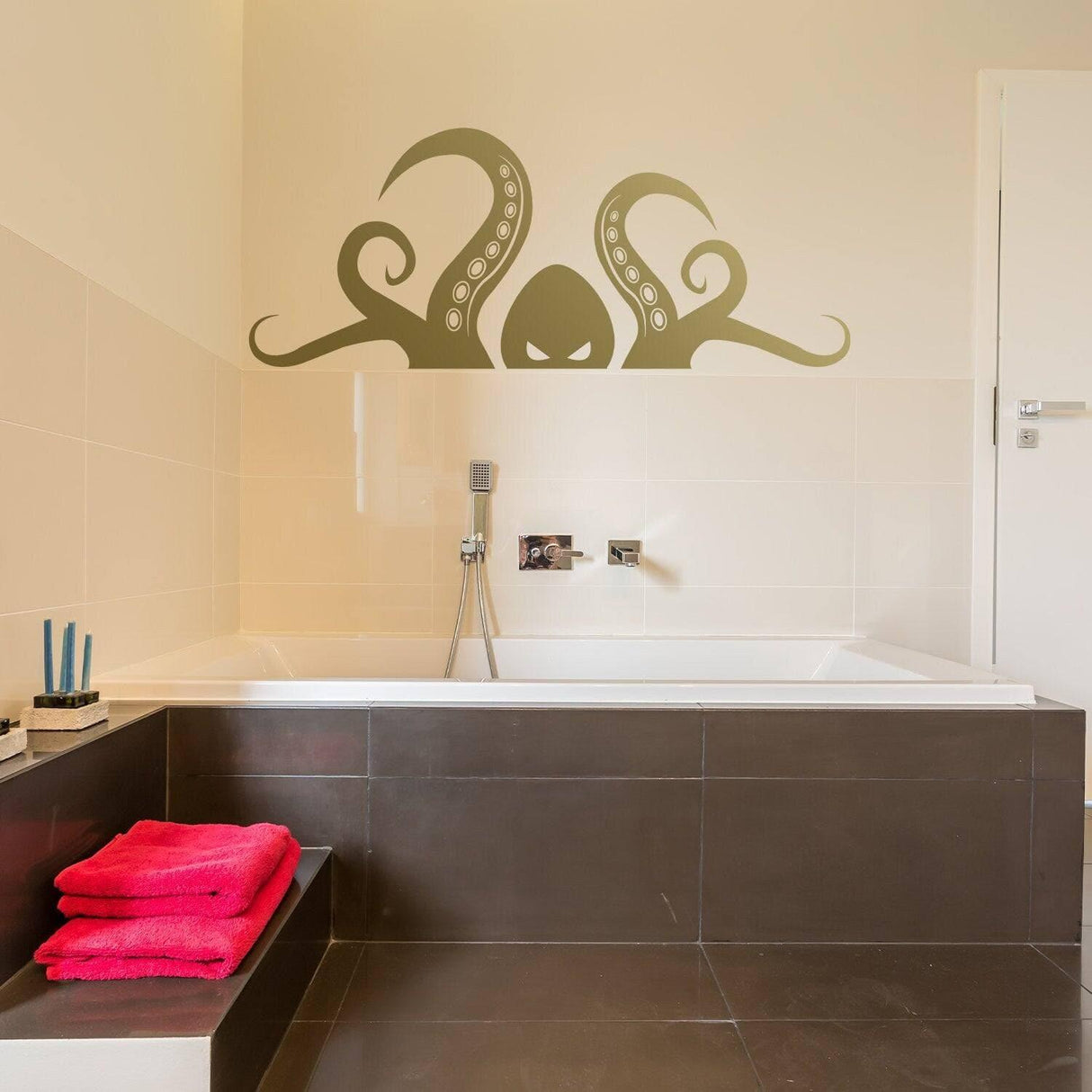 Octopus tentacle wall decal in a modern bathroom, enhancing the oceanic theme with pink towels.