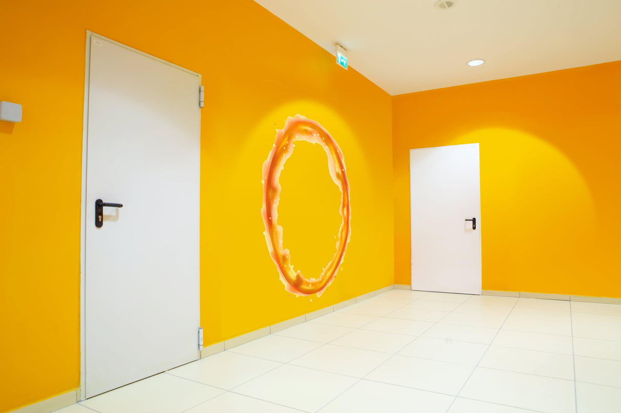 Vibrant orange wall with a dynamic blue and orange portal aura wall sticker in a modern room.