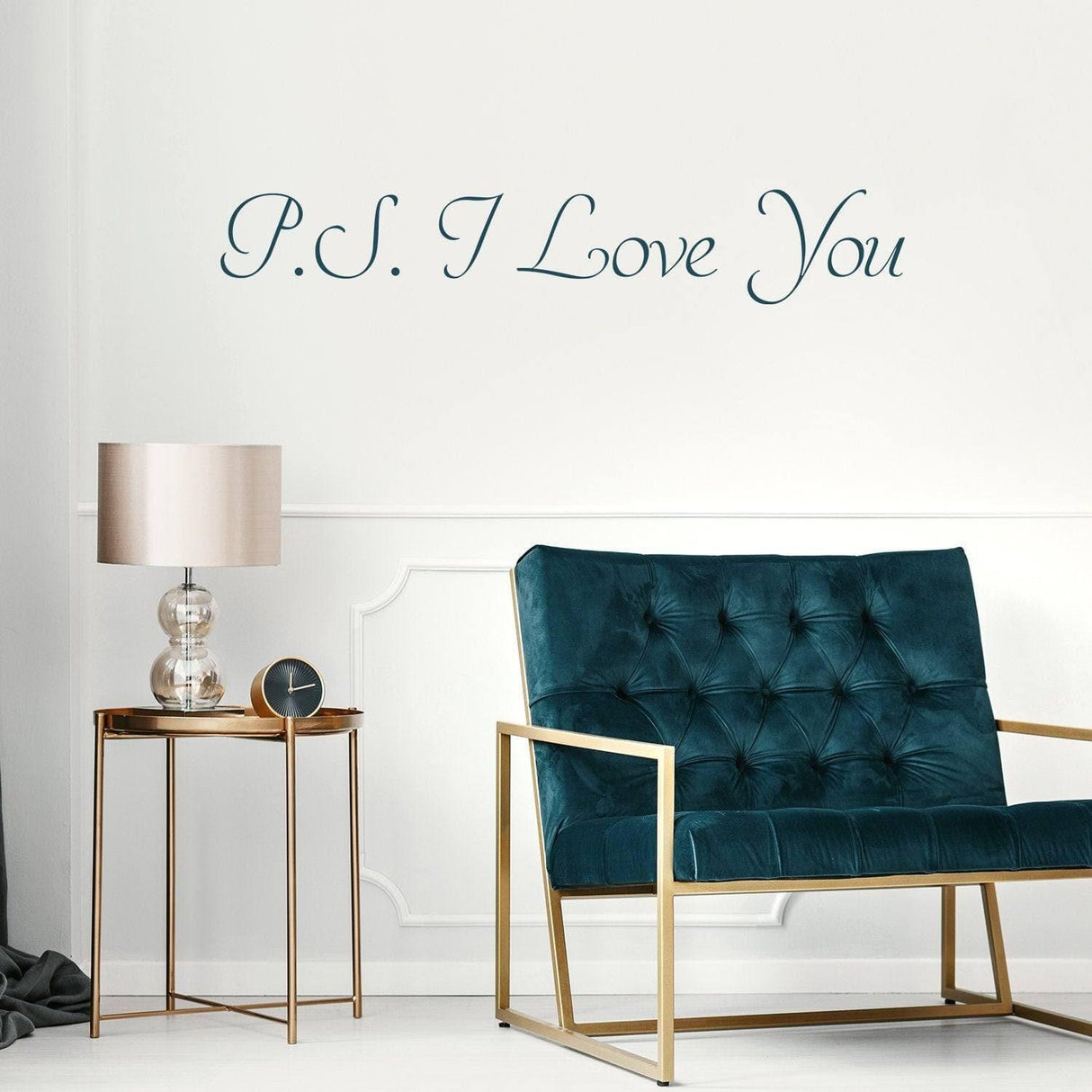 Romantic wall decal with 'P.S. I Love You' on wall above a modern blue chair and side table, perfect for bedroom decor.