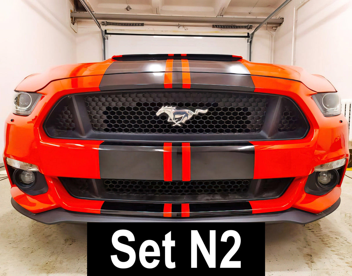 Front view of a red sports car featuring racing stripes vinyl decals, showcasing a sleek and sporty design.