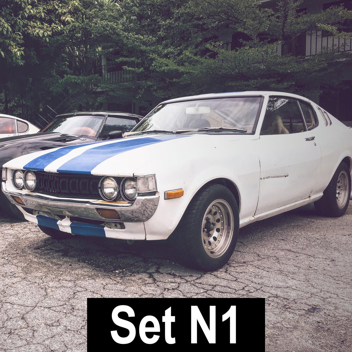 Classic car with blue racing stripes, showcasing a stylish and sporty design, ideal for vinyl decals.