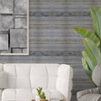 Rustic self-stick wooden plank wall decal in stylish living room with white couch and modern artwork.