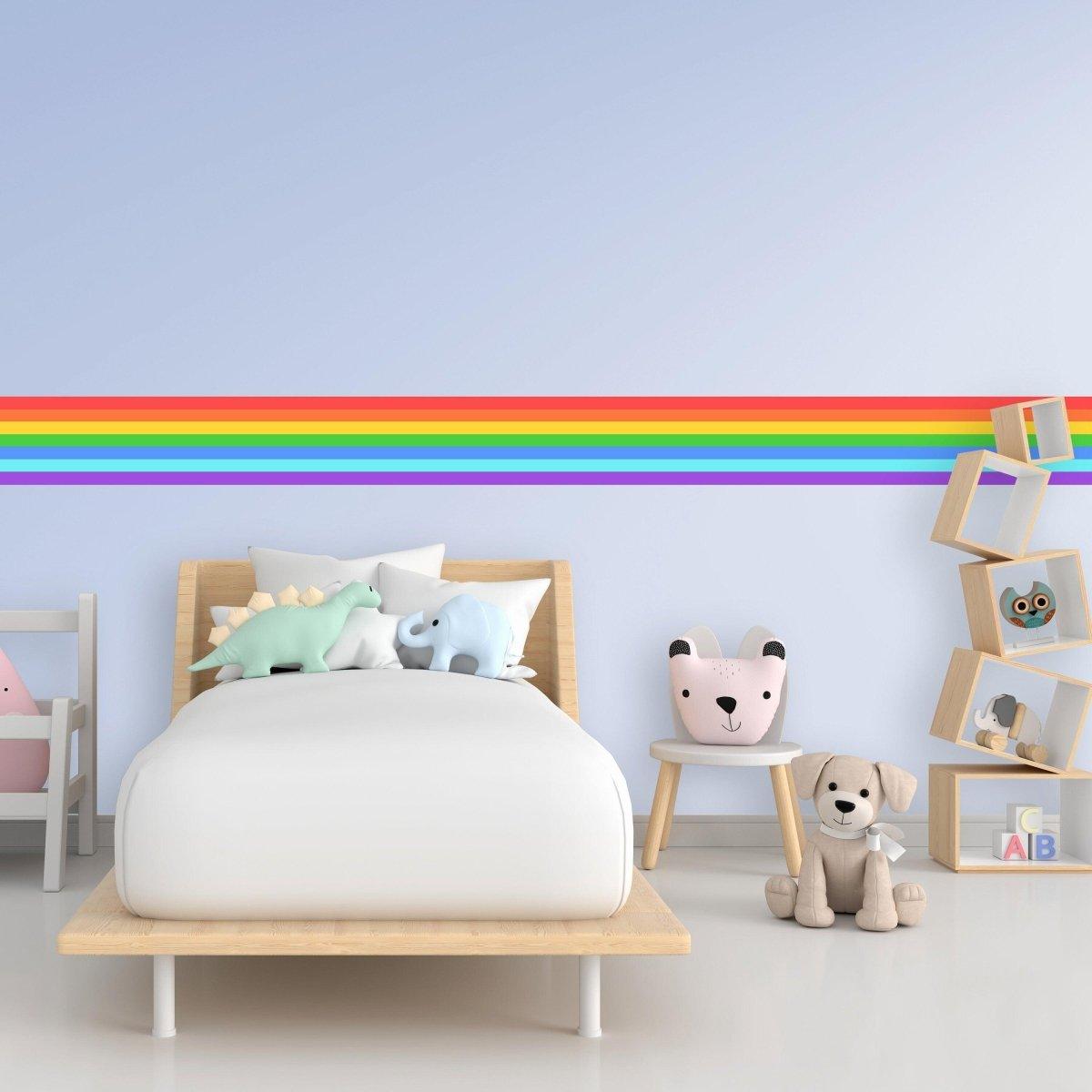 Vibrant rainbow stripe vinyl sticker in a cozy children's bedroom, enhancing the playful decor.