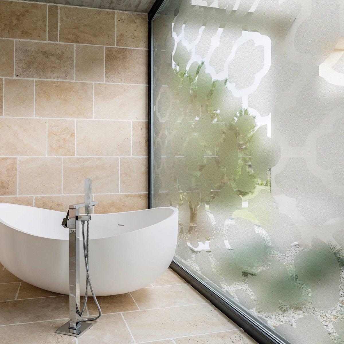 Stylish frosted window film in a modern bathroom providing privacy and light while enhancing decor.