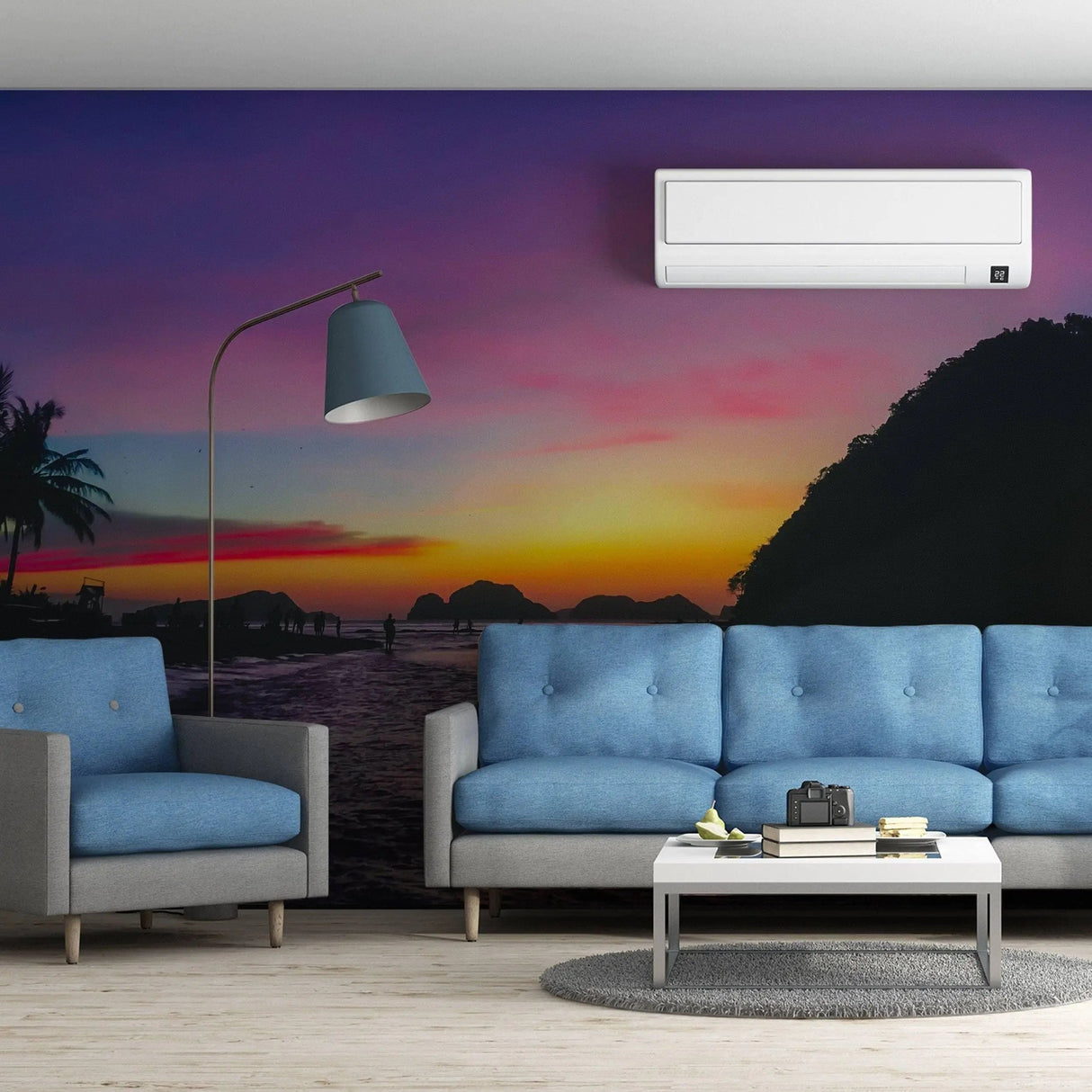 Urban sunset skyline wall stickers in modern living room decor with blue sofas and stylish lamp.