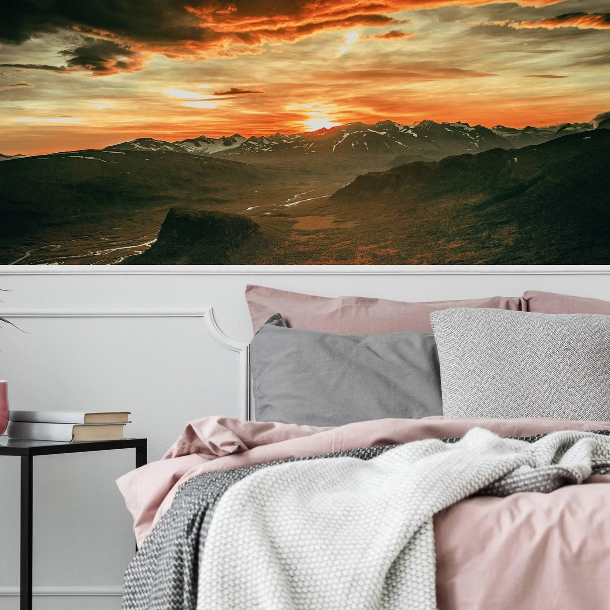 Majestic sunset wall sticker decor in a cozy bedroom, showcasing vibrant colors and mountain scenery.