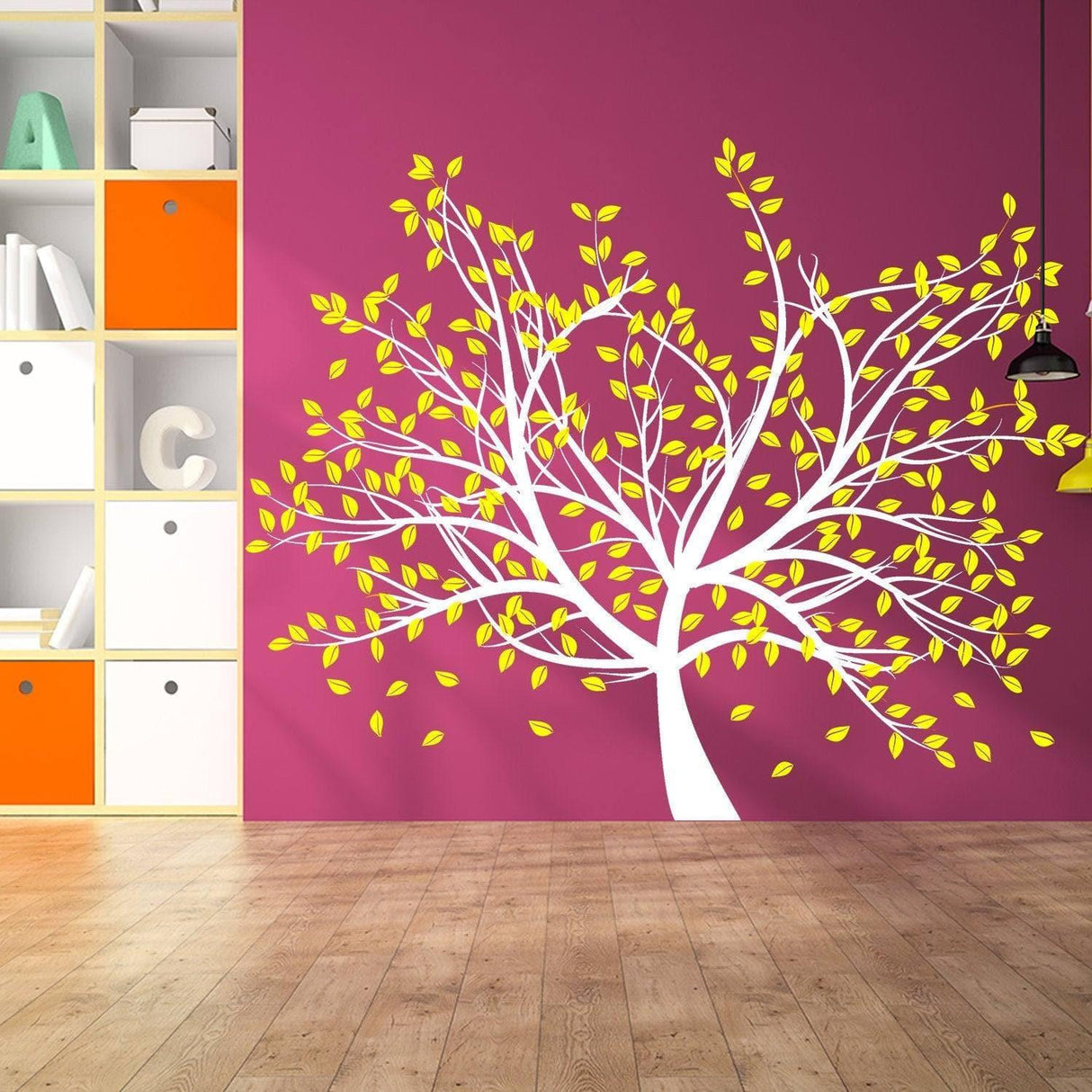 Tree wall decal with yellow leaves on a pink background, showcasing a beautiful and artistic home decor design.