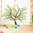 Nature's Serenity tree vinyl wall decal with green leaves, perfect for home decor, easy to install, and durable.