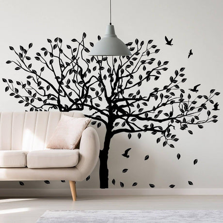 Nature-inspired tree wall decal sticker for home decoration, featuring leaves and birds in black silhouette.