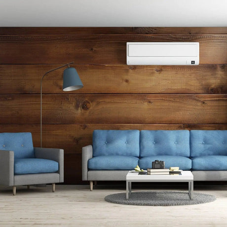 Modern living room featuring wooden wall, blue sofas, and stylish lamp, showcasing wooden effect vinyl decals.