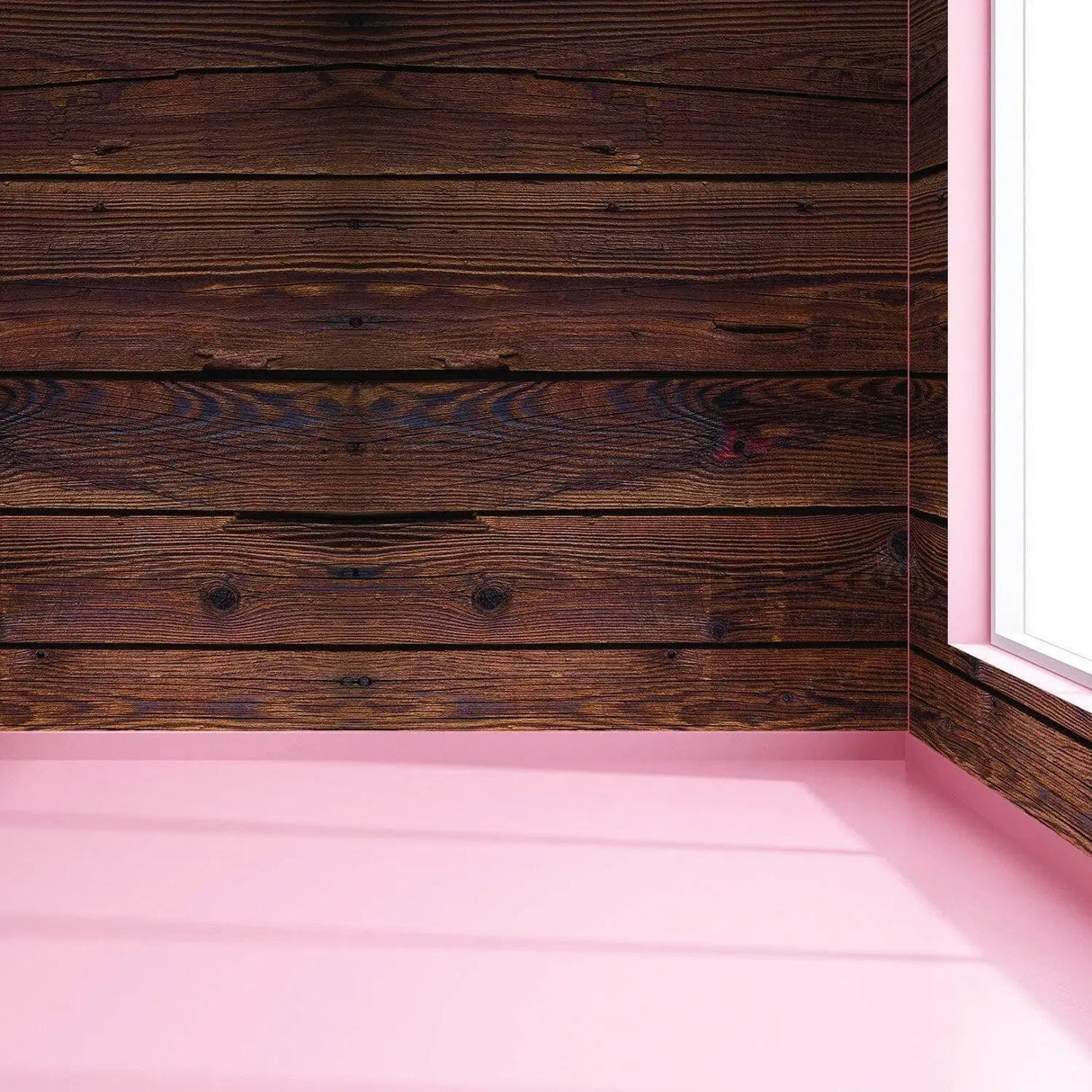 Rustic wood peel and stick wall decal showing dark wooden panels in a corner with pink wall accents.