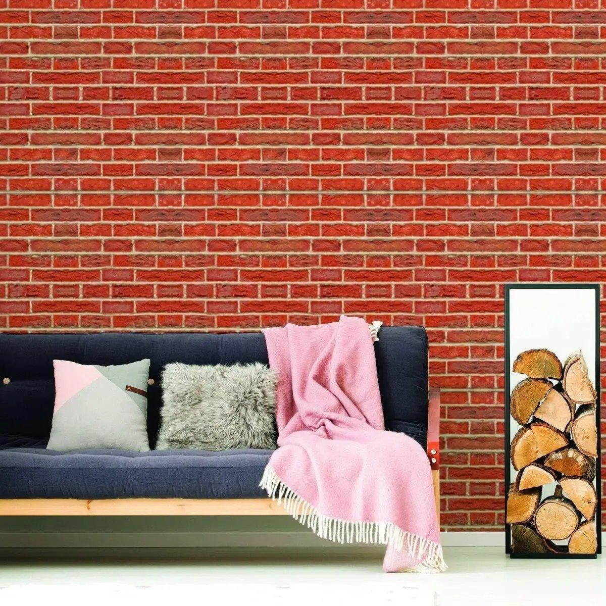 Cozy living room featuring a brick wall, soft pillows, and a pink throw blanket. Perfect for home makeover inspiration.