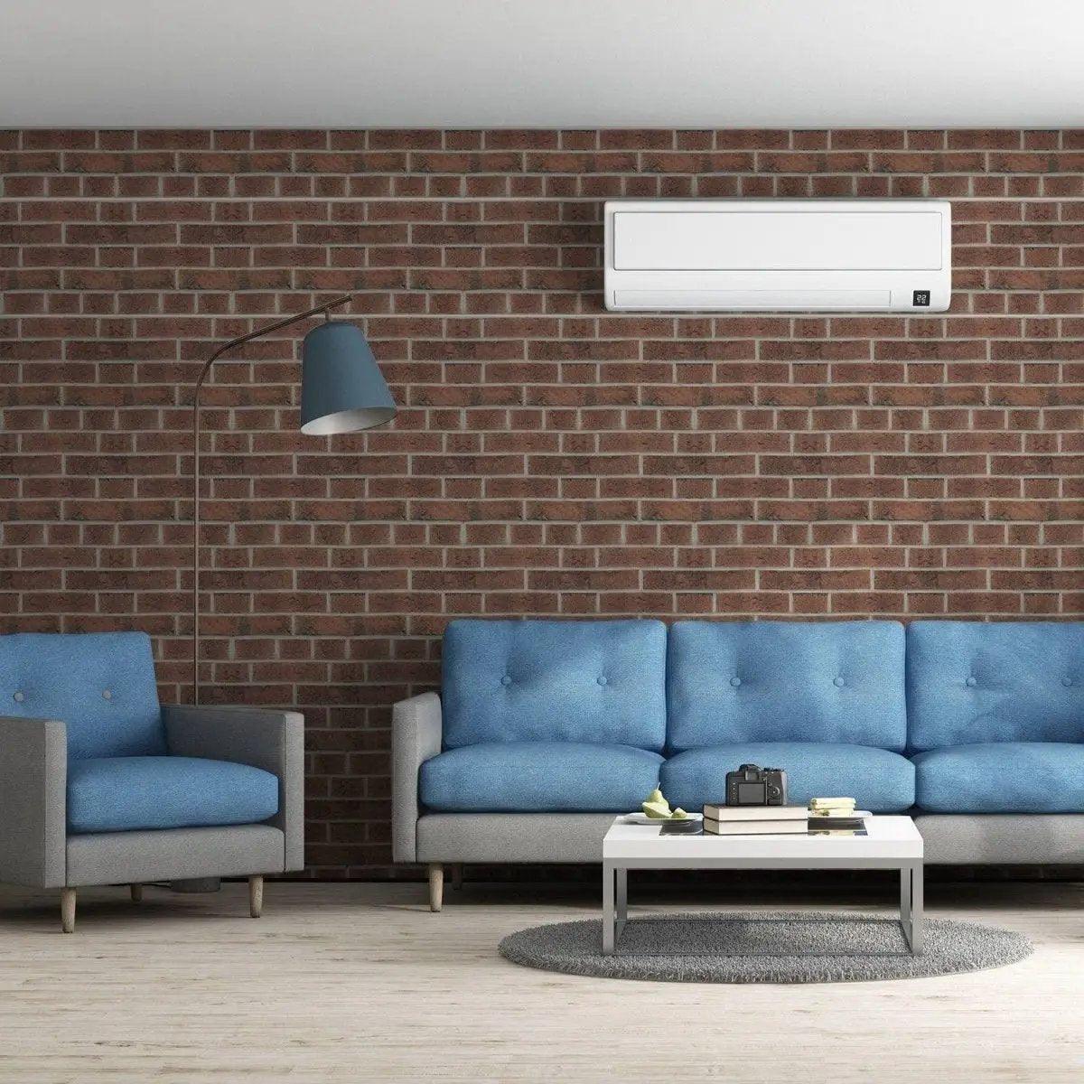 Living room featuring 3D stone wall vinyl wallpaper with blue couches and modern decor.