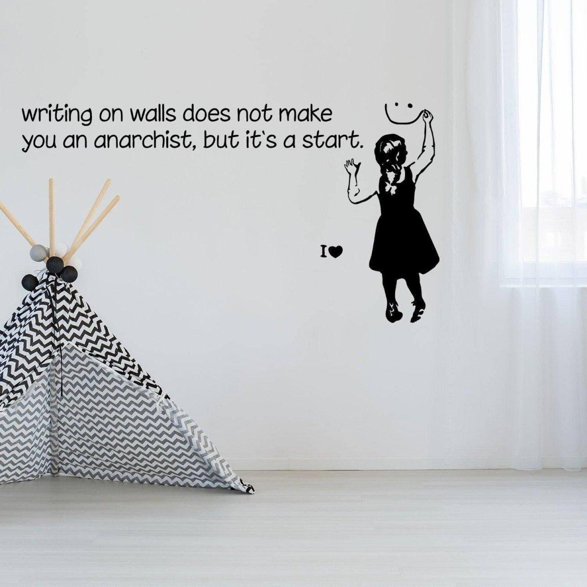 Banksy-inspired wall sticker with text: 'writing on walls does not make you an anarchist, but it’s a start.'