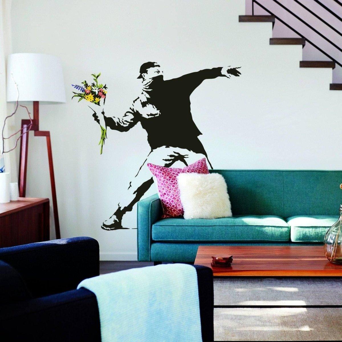Banksy-style vinyl wall decal of a figure throwing flowers, adding artistic flair to modern home decor.