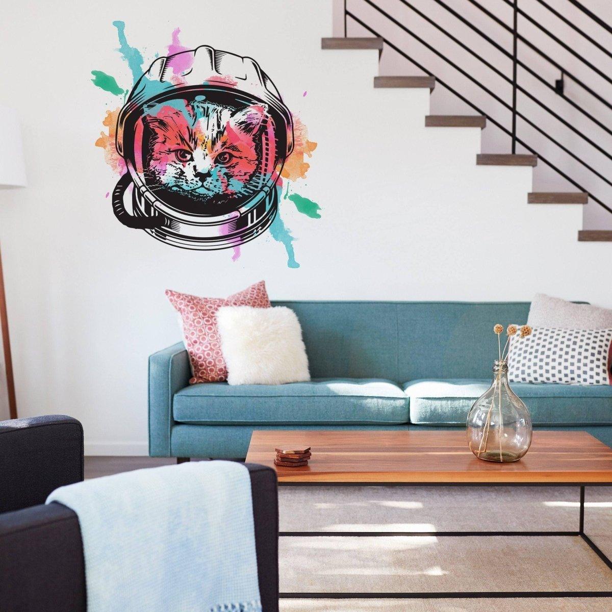 Whimsical astronaut kitty wall decal in a modern living room, adding vibrant space-themed decor.